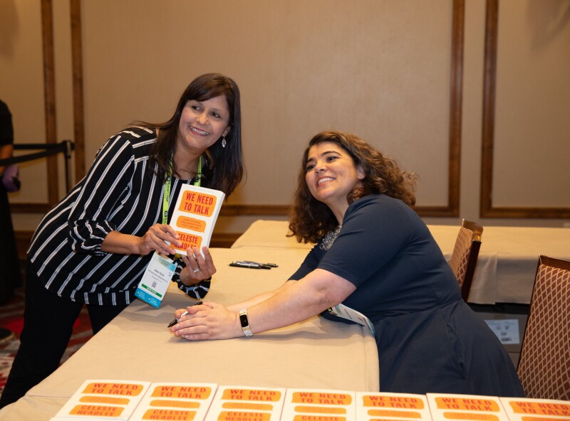 Celeste signing books for the audience